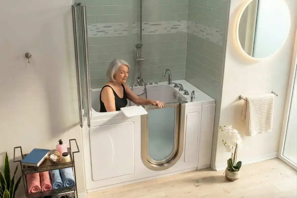 Woman seated inside a walk-in tub with the door closed (Walk-in tubs for Pasadena homes)